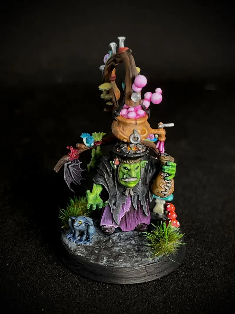 A goblin warlock with a tall hat covered in pink mushrooms