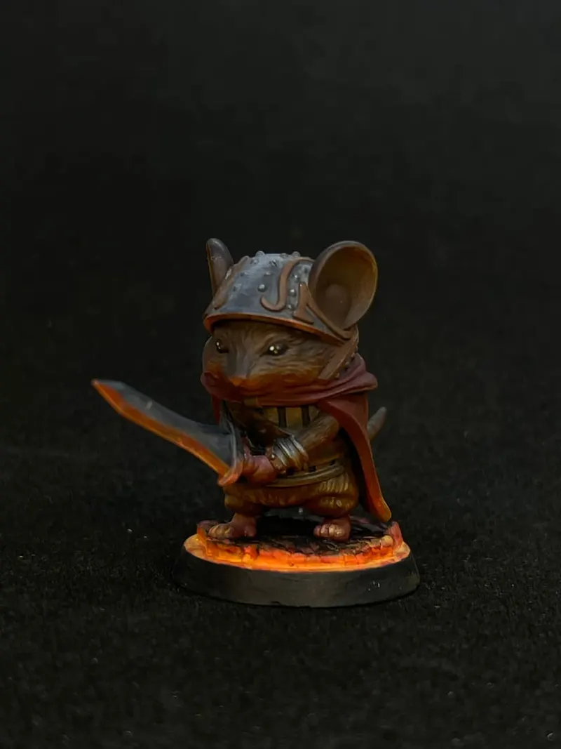 A mouse knight in a brown cloak with a glowing orange sword