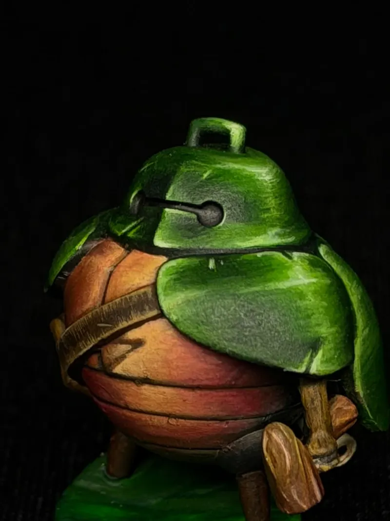 A round creature under a green leaf shell, strapped with leather belts